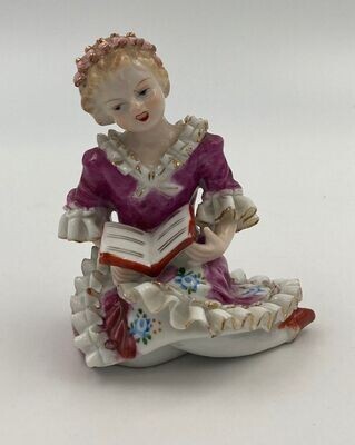 Vintage Wales Porcelain Victorian Plum Color Figurine. Highly detailed Girl with a Book in Sculptured Ruffled Period Clothes.