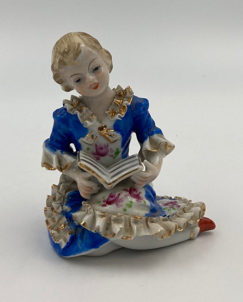 Vintage Wales Porcelain Victorian Blue Color Figurine. Highly detailed Girl with a Book in Sculptured Ruffled Period Clothes.