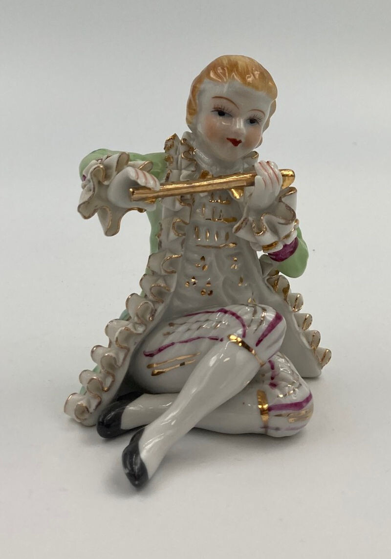 Vintage Boy Playing Flute Green Coat Figurine. Highly detailed Boy with a Flute in Sculptured Ruffled Period Clothes.