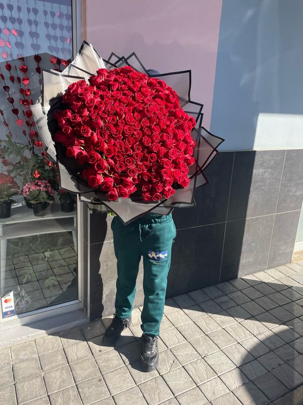 200 Red Roses Hand Tied, Wrapped In Black