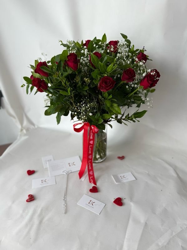 20 Red Roses With Babies Breath And Greenery In A Vase