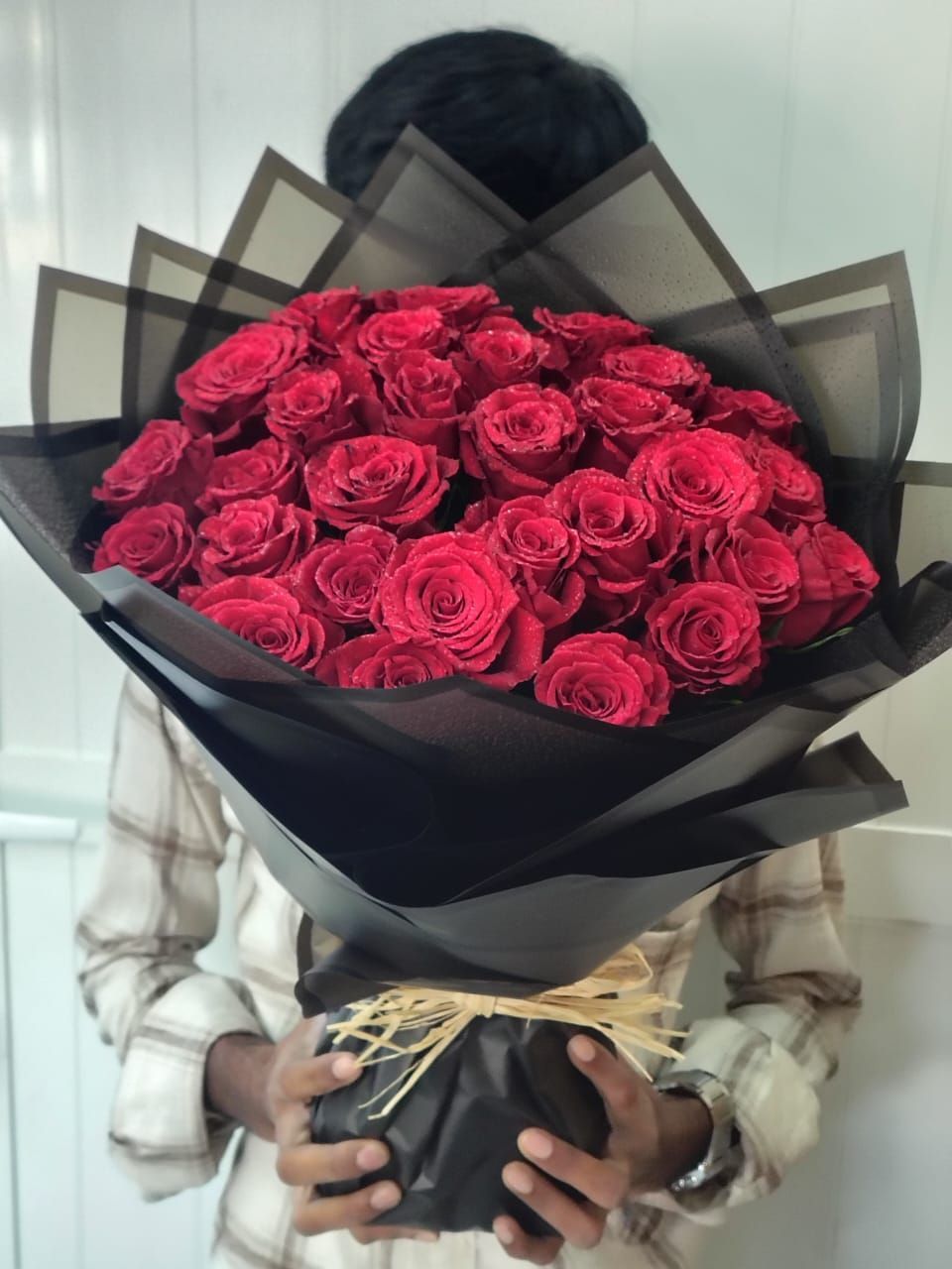 Red Roses in Black Wrapper