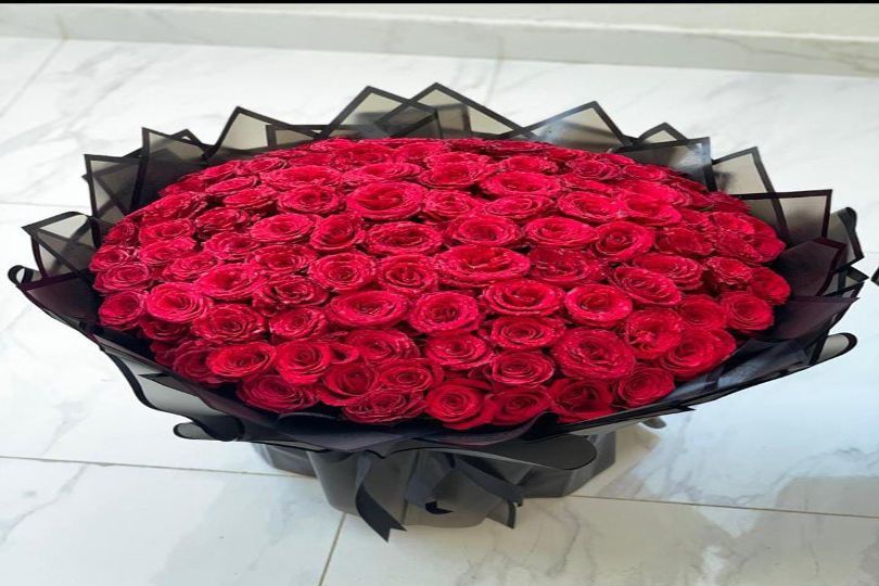 71 Red Roses in Black Wrapper