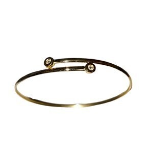 Pulsera rígida en oro amarillo con cabezales de brillante