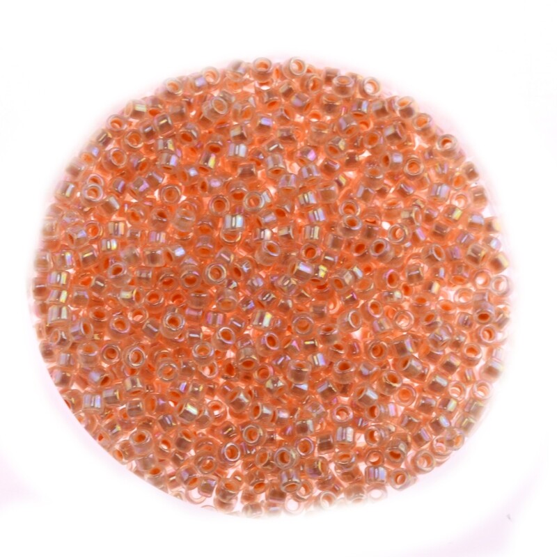 Japanische Zylinderperlen Toho Treasure Inside-Color Rainbow Crystal/Apricot Lined 1,8mm/ 5g