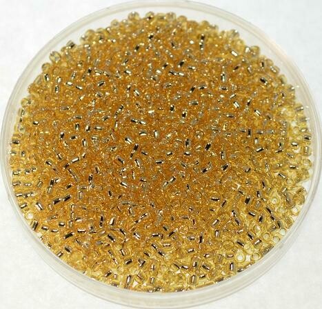 Toho 15/0 Silverlined gold / 10 g