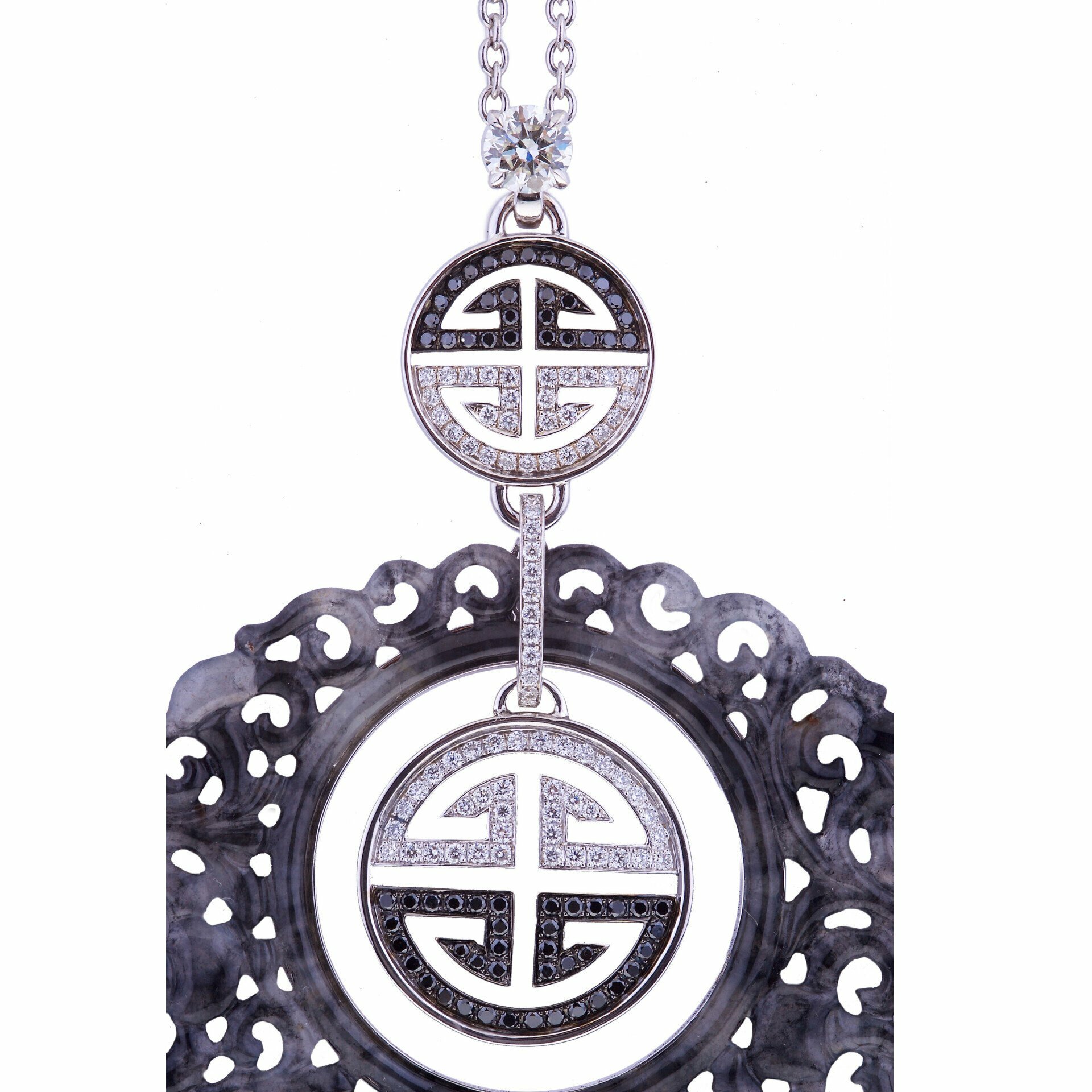 White gold with creola carved black jade red coral and round solitaire diamond