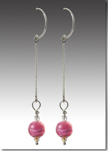 Crystal earrings with cremains entwined.