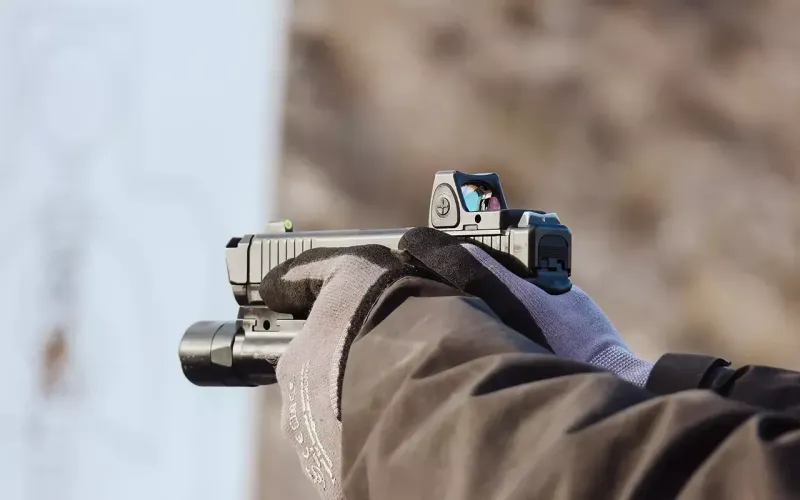 Close-up of red-dot sight on concealed carry pistol during live-fire Immersion course.
