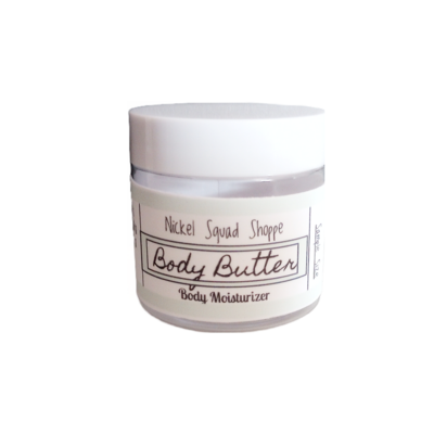 Small circular container with a white lid and a pale-green label around the body containing product ingredients. 