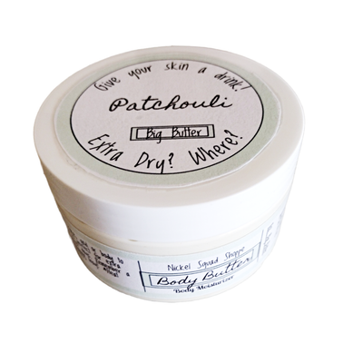Large circular container with a white lid and a pale-green label around the body containing product ingredients.