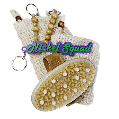 purple and green key chain with a sisal fiber hair brush and two soap savers