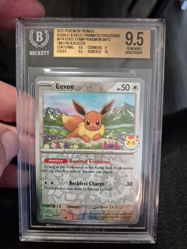 2025 Pokémon Prismatic Evolutions #074 Eevee (Pokémon Day Stamp Promo) becket grading gold label