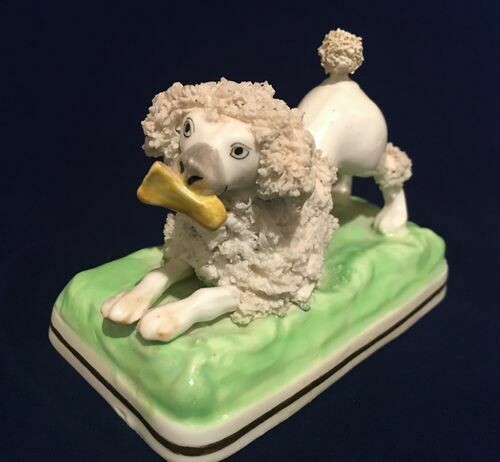 Antique Staffordshire Pottery Poodle with Bone