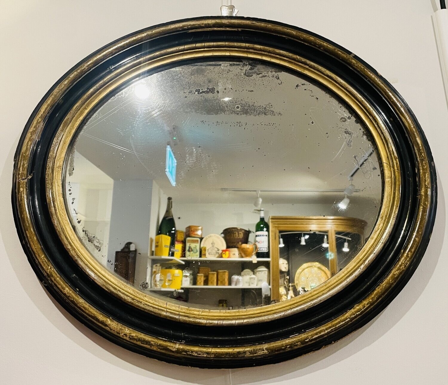 Antique Ebonised and Gilt Oval Wall Mirror