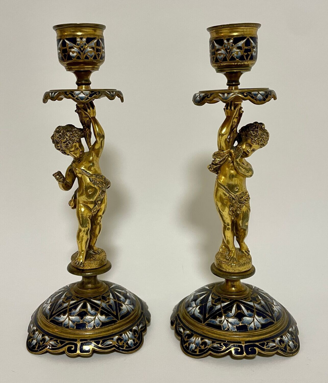 Pair of Antique Gilt and Enamel Putti Candlesticks