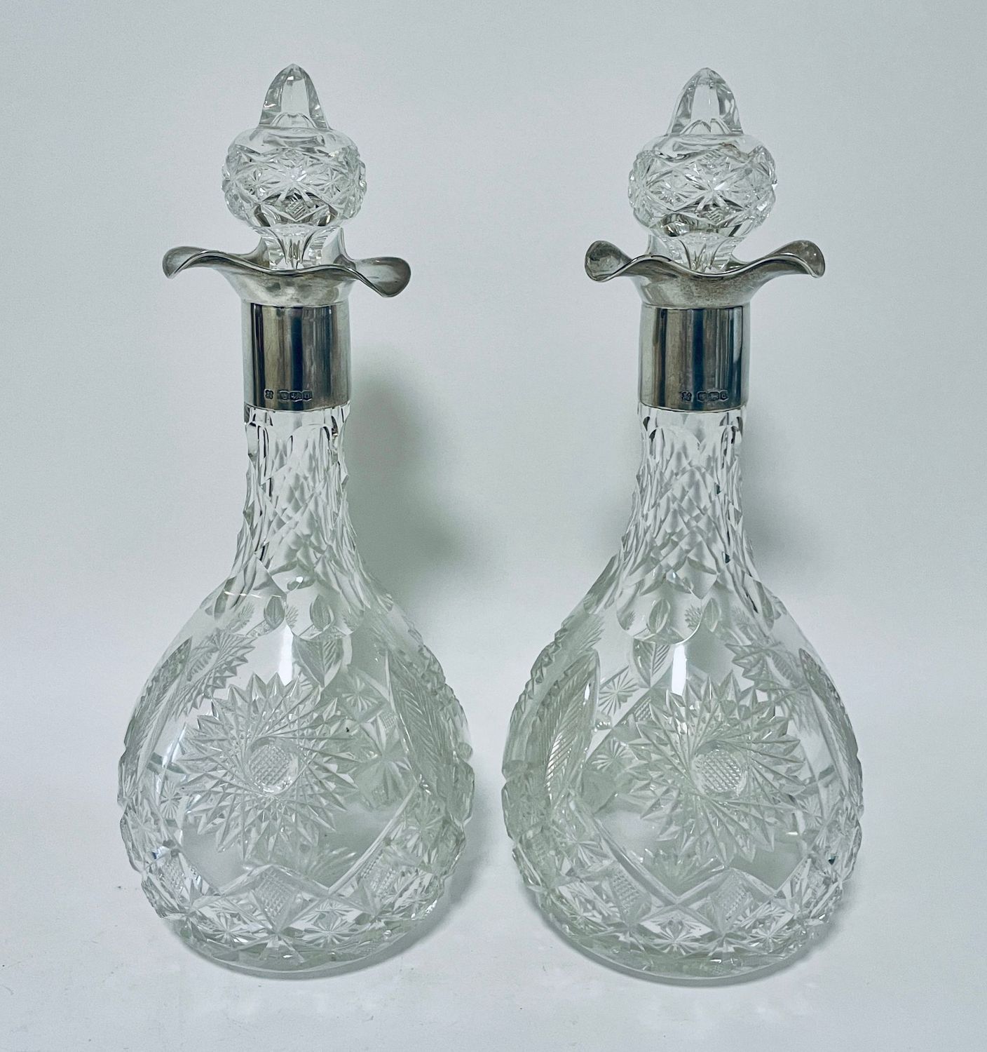 Pair of Silver Mounted Cut Glass Decanters