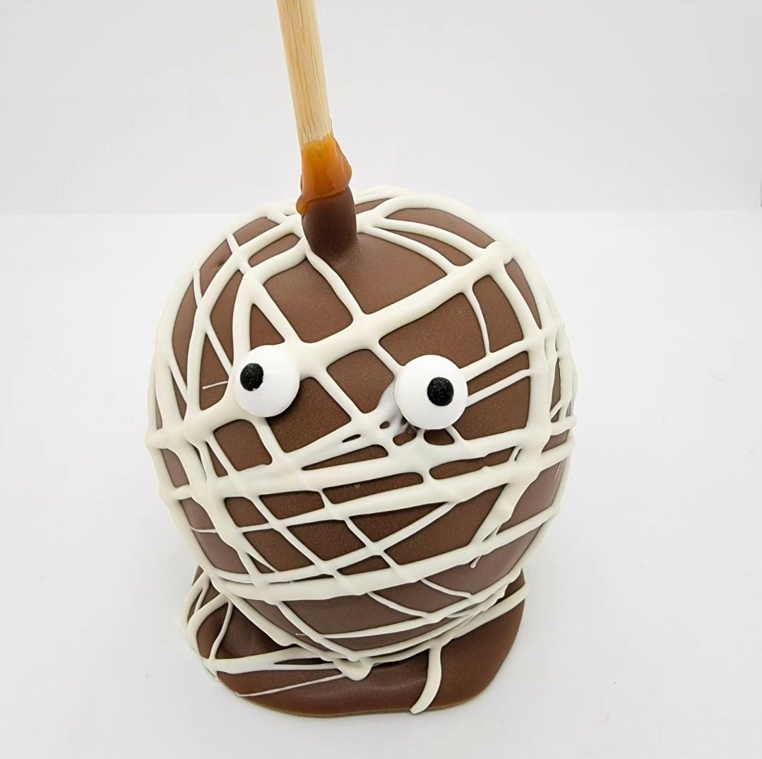 Milk Chocolate and White Chocolate Mummy (available October 24th-31st) Milk Chocolate and White Chocolate Mummy (available October 24th-31st)