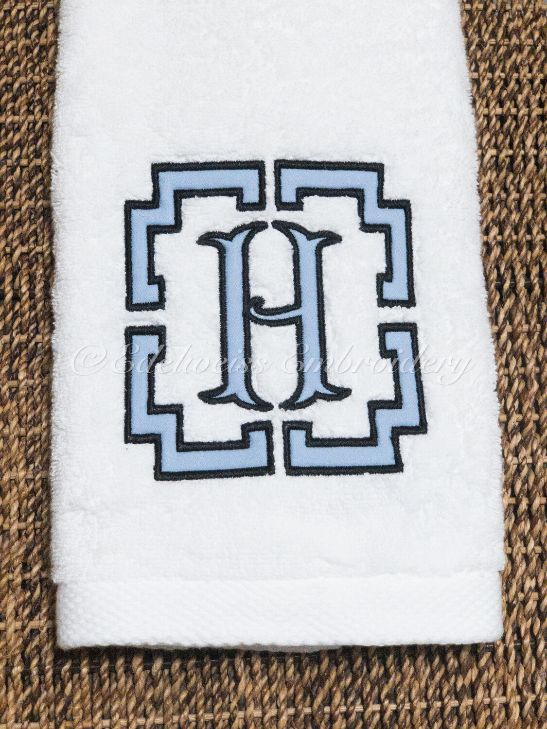 Pemberley  Border With Fancy fishtail Appliqué On A Guest Towel
