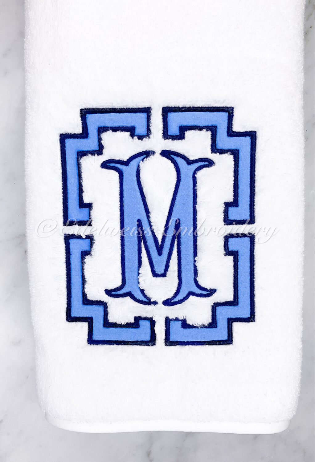 Pemberley  Border With Fancy fishtail Appliqué On A Guest Towel
