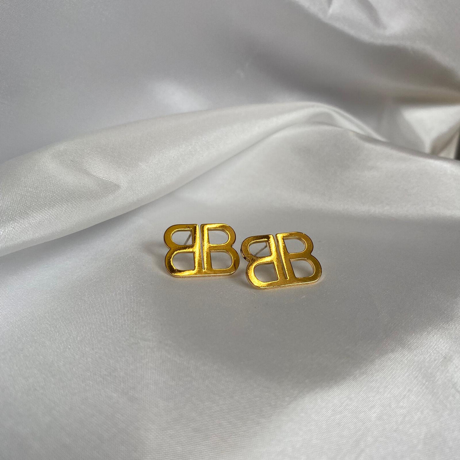 BALLY gold earrings