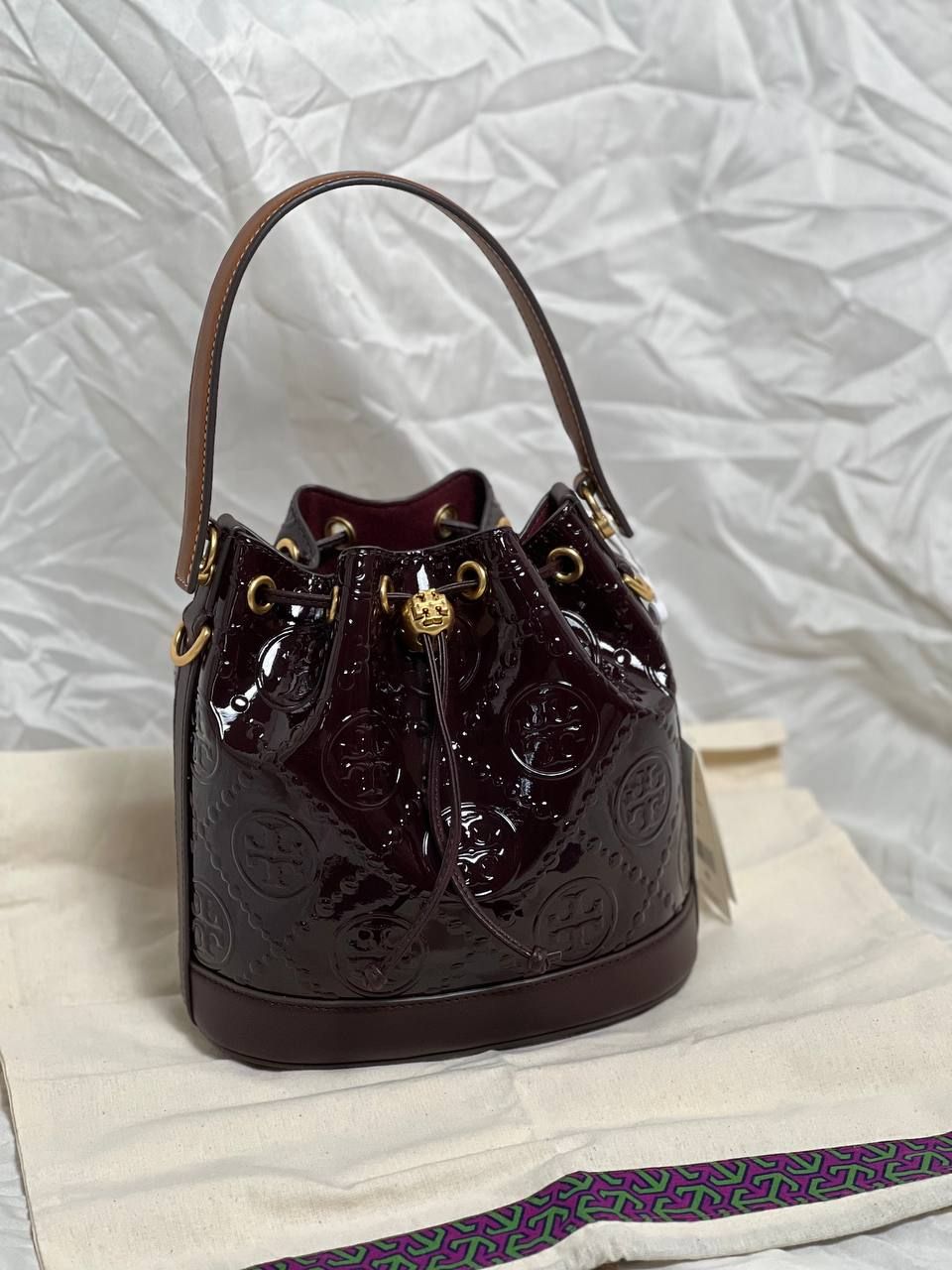 TORY BURCH T Monogram Patent Embossed Bucket Bag