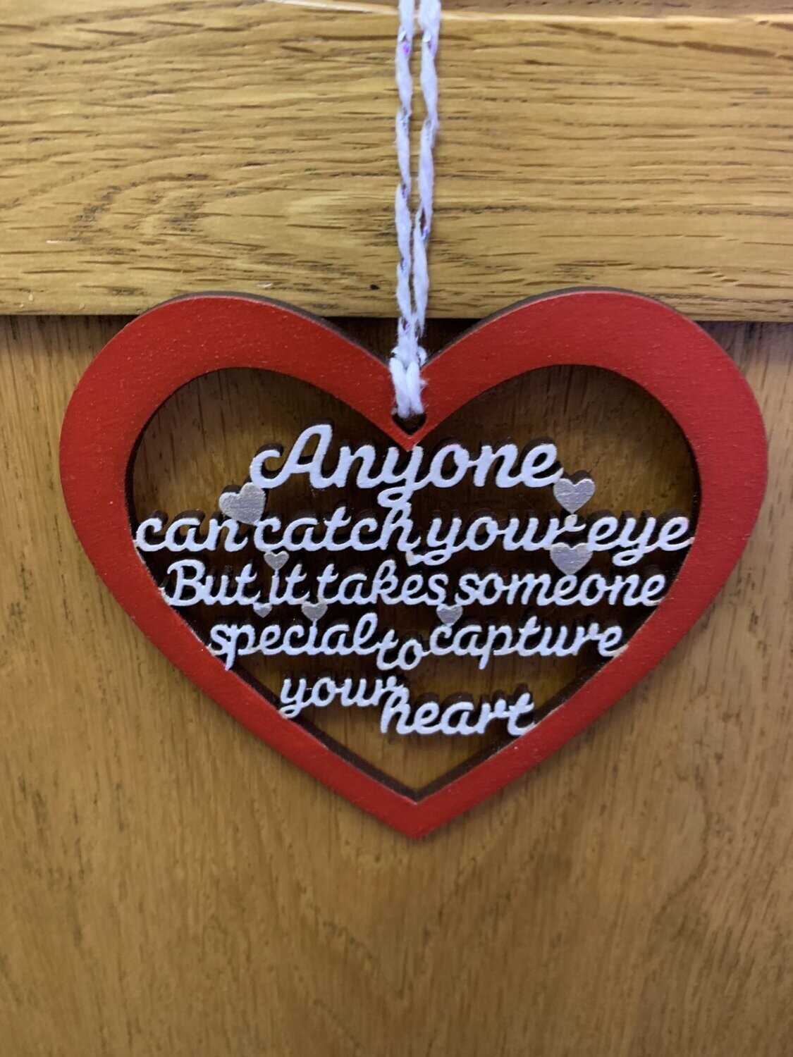 Anyone can catch your eye hanging heart quote