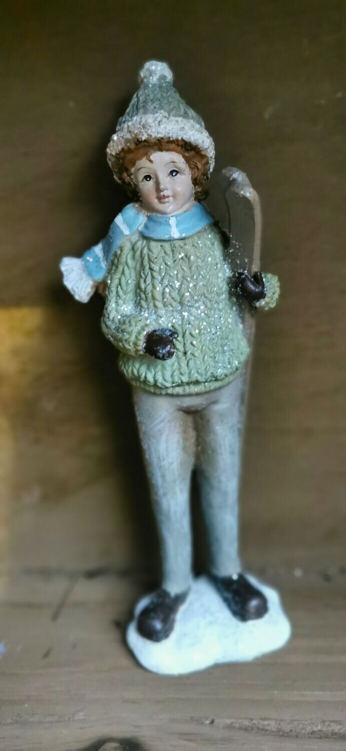 Mädchenfigur Winter, mit Ski, pistazienfarben, beglittert, Kunstharz; H20cm