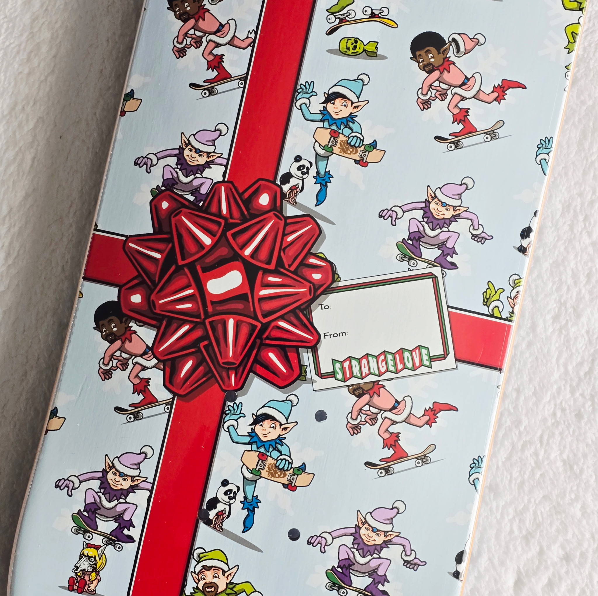 Strangelove Skateboards Elves Holiday Gift Wrap Deck 8