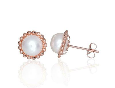 Gold earrings are pierced with pearls