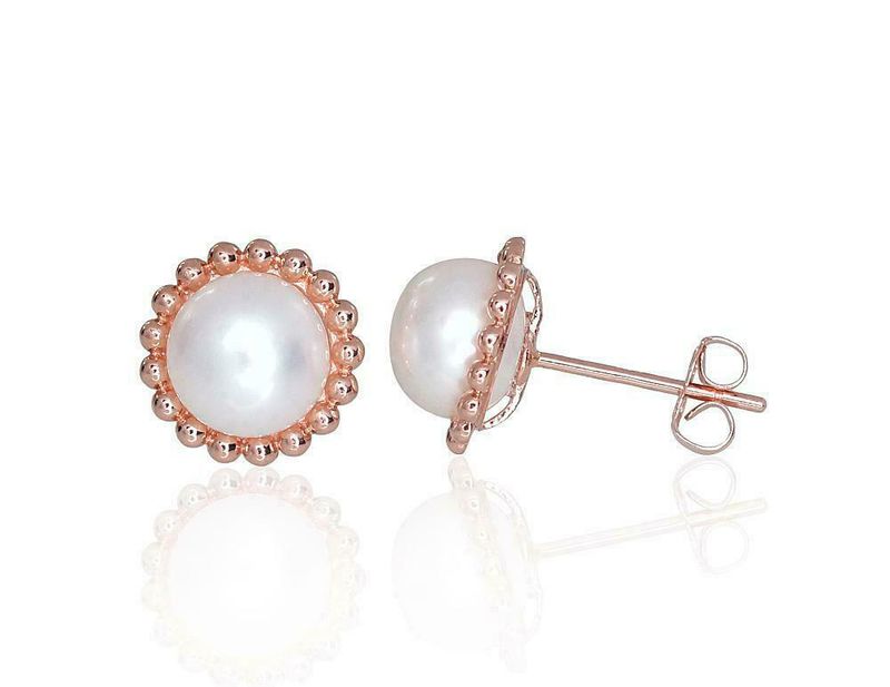 Gold earrings are pierced with pearls Gold earrings are pierced with pearls
