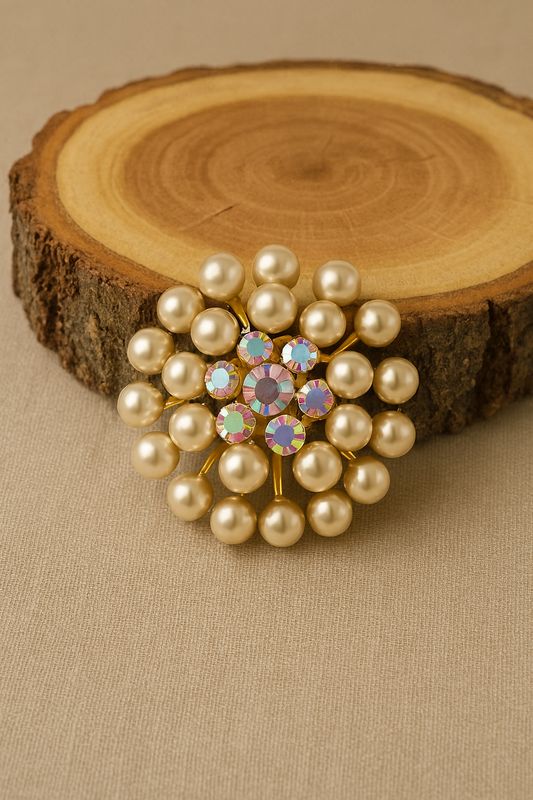 Faux pearls &amp; gold-tone floral starburst.	Starburst of gold and aurora light—faux pearls 