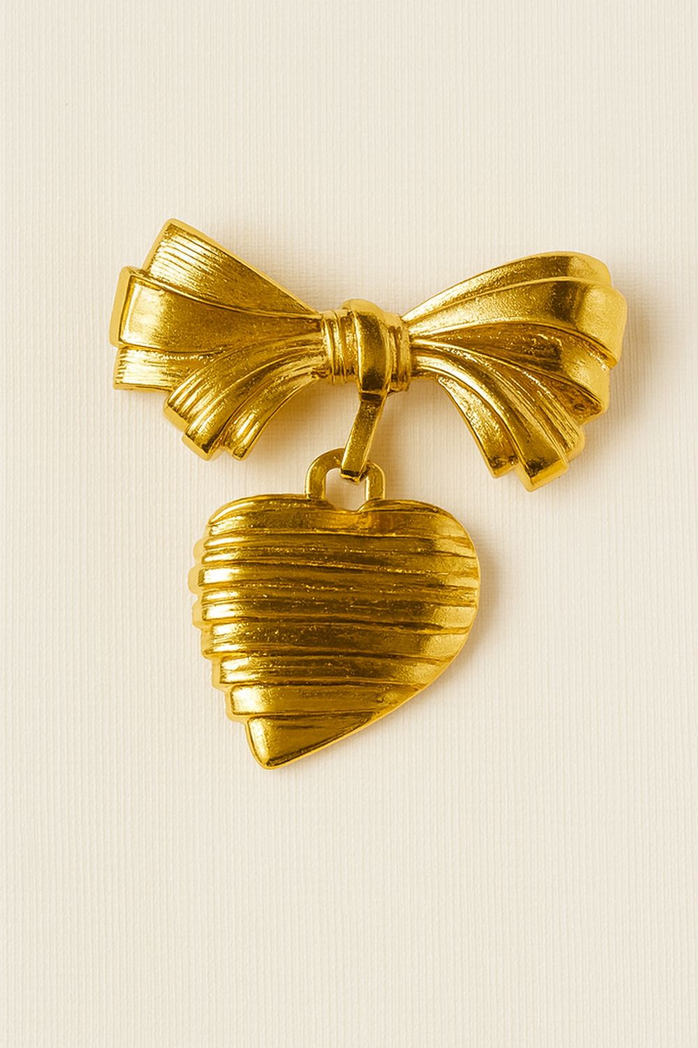 Avon Vintage Bow Brooch with Dangling Etched Heart – Gold Tone Keepsake of Love