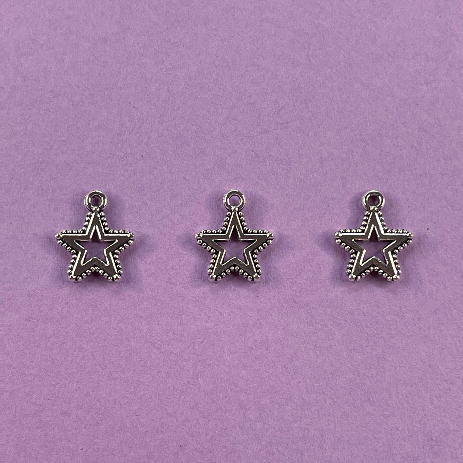 Dije de Metal Plateado Estrella Calada Labrada 14 x 12 x 1.5 mm