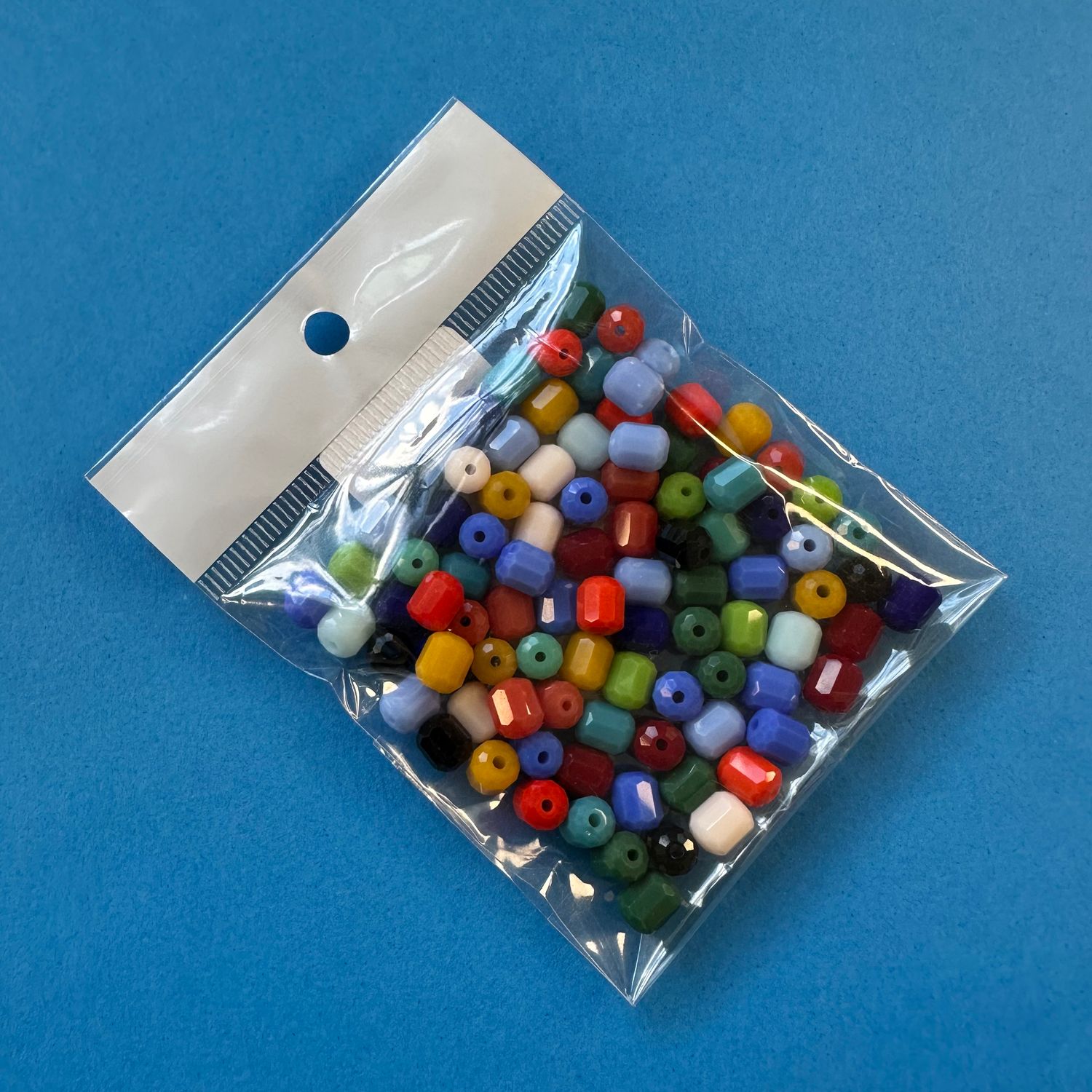 Cristal Barril Facetado Opaco MIX en Bolsa 6.5 x 6 mm