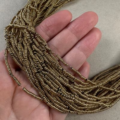 Piedra Sintética Hematite Donita Mini 2 x 1 mm Dorada Bañada Oro 18 K.