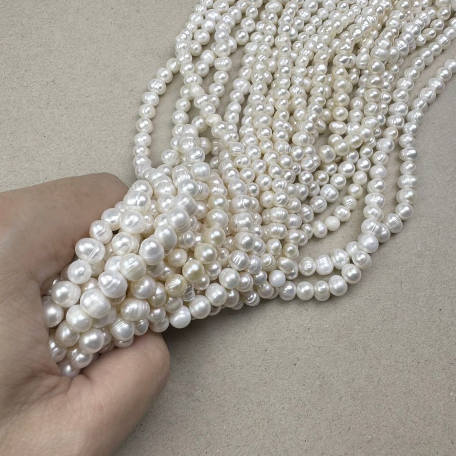 Piedra Natural Perla de Río Oval Papa 5 - 6 mm Blanca