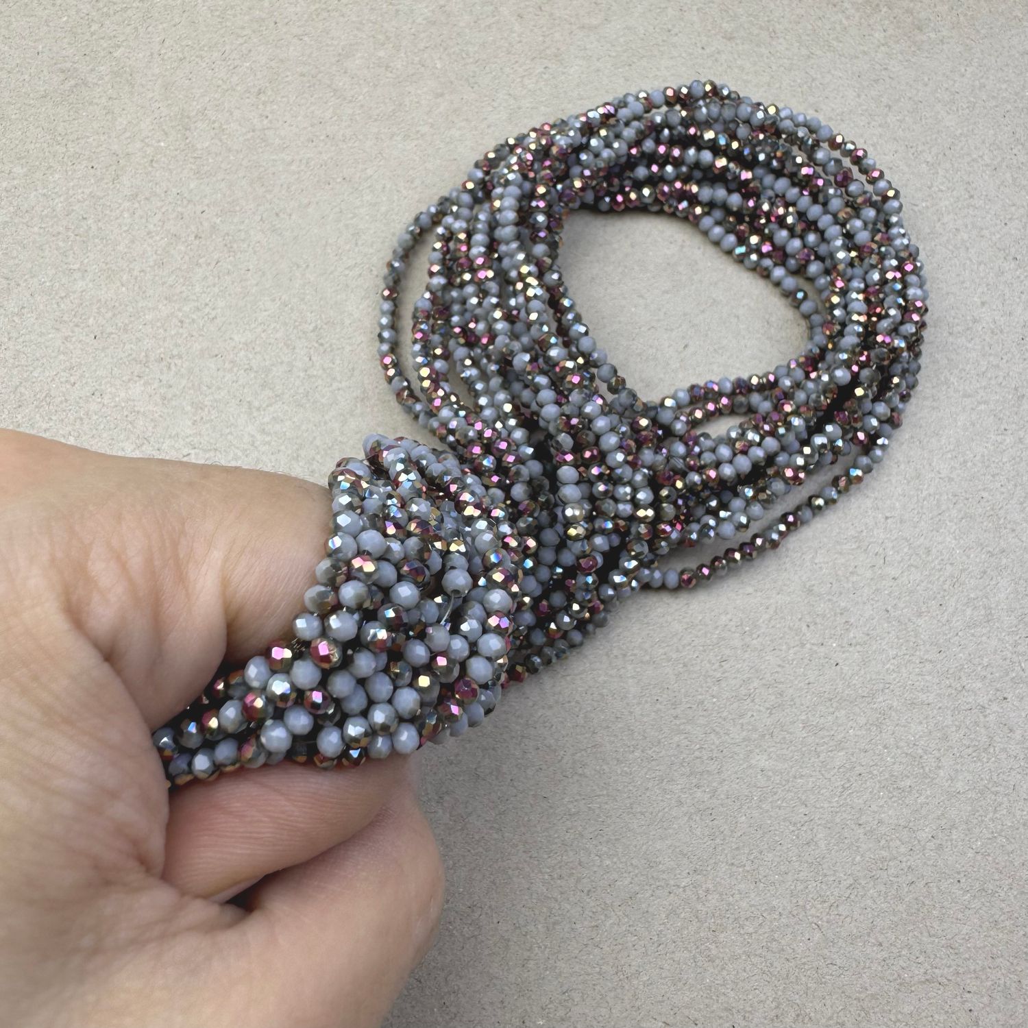 Cristal Dona Facetada Opaca 1/2 Metalizado Iris Rosa 3 x 2.5 mm Gris