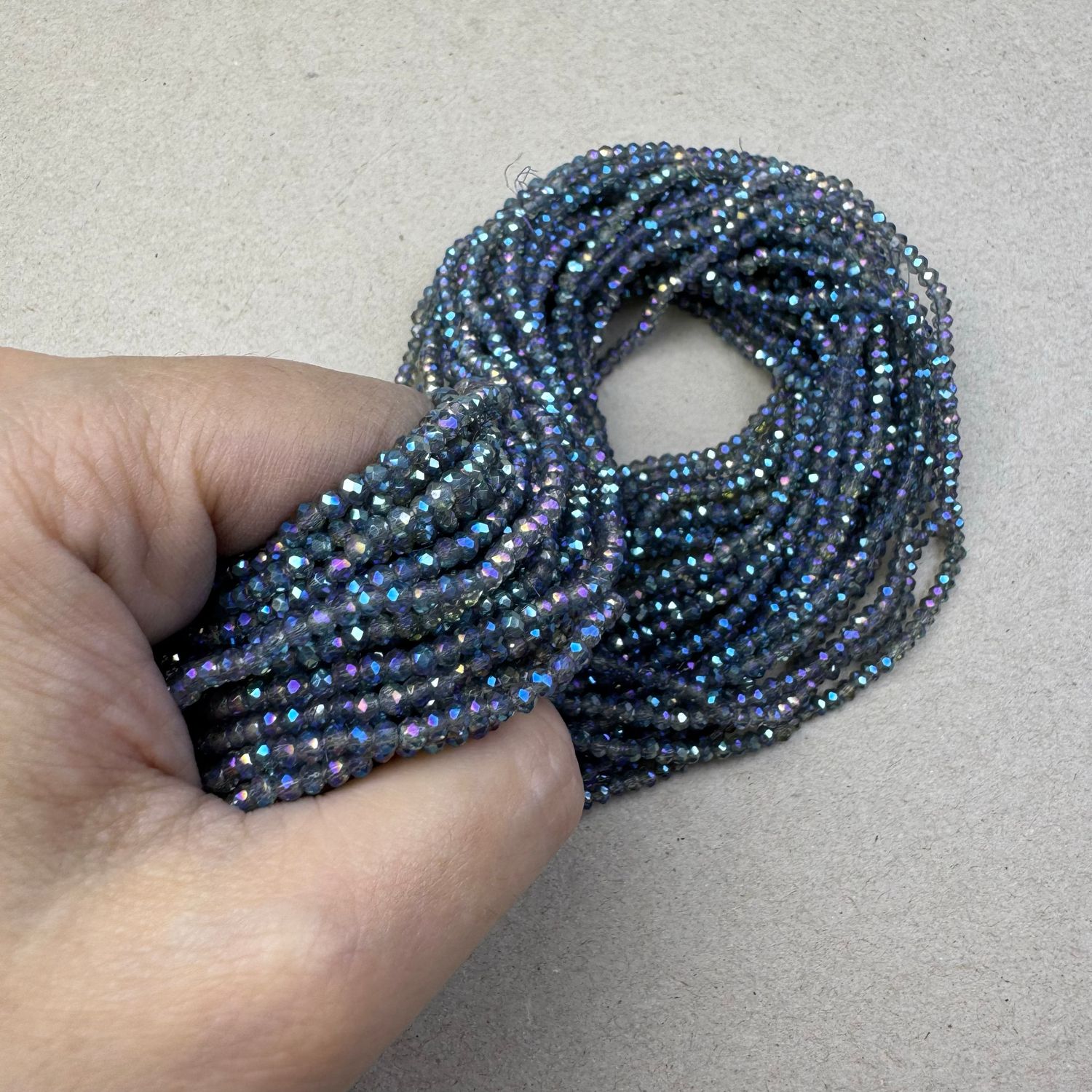 Cristal Dona Facetada Transparente AB (Tornasol) 3 x 2.5 mm Azul Piedra