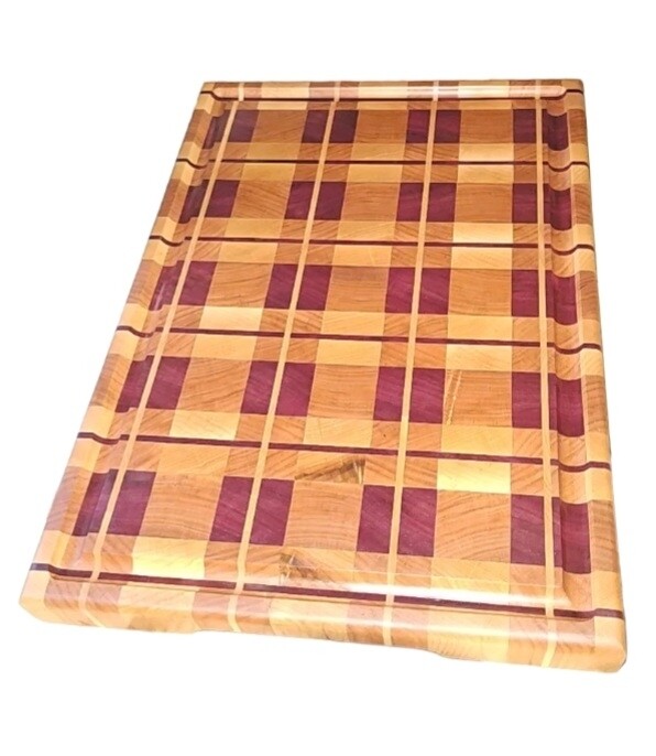 12" x 16" x 1.5" single strip plaid with juice groove and cut in handles using maple, cherry, and purpleheart
