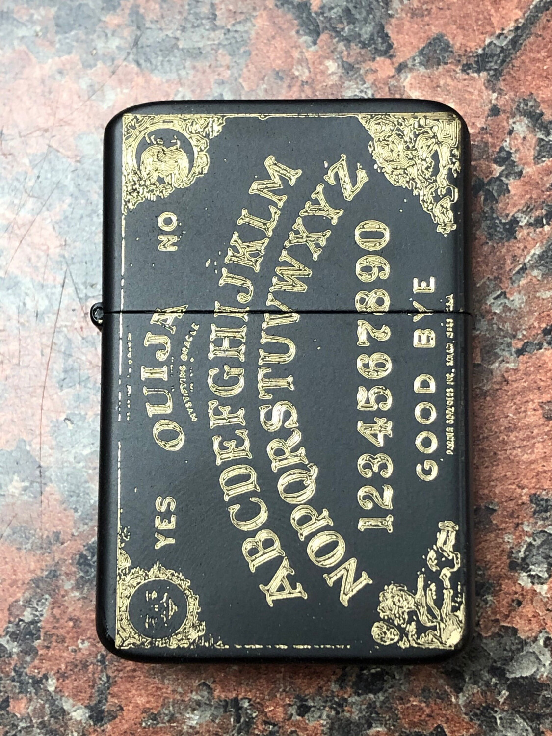Ouija Board Lighter, Matte Black/Antique Brass Finish Ouija Board Lighter, Matte Black/Antique Brass Finish