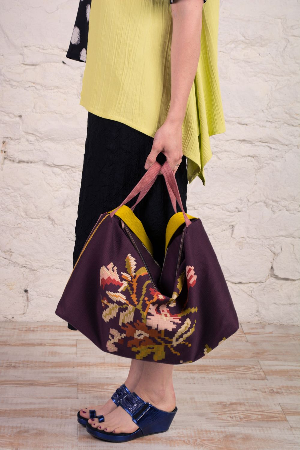 The Boulder Bag made in eggplant purple floral upholstery fabric. 