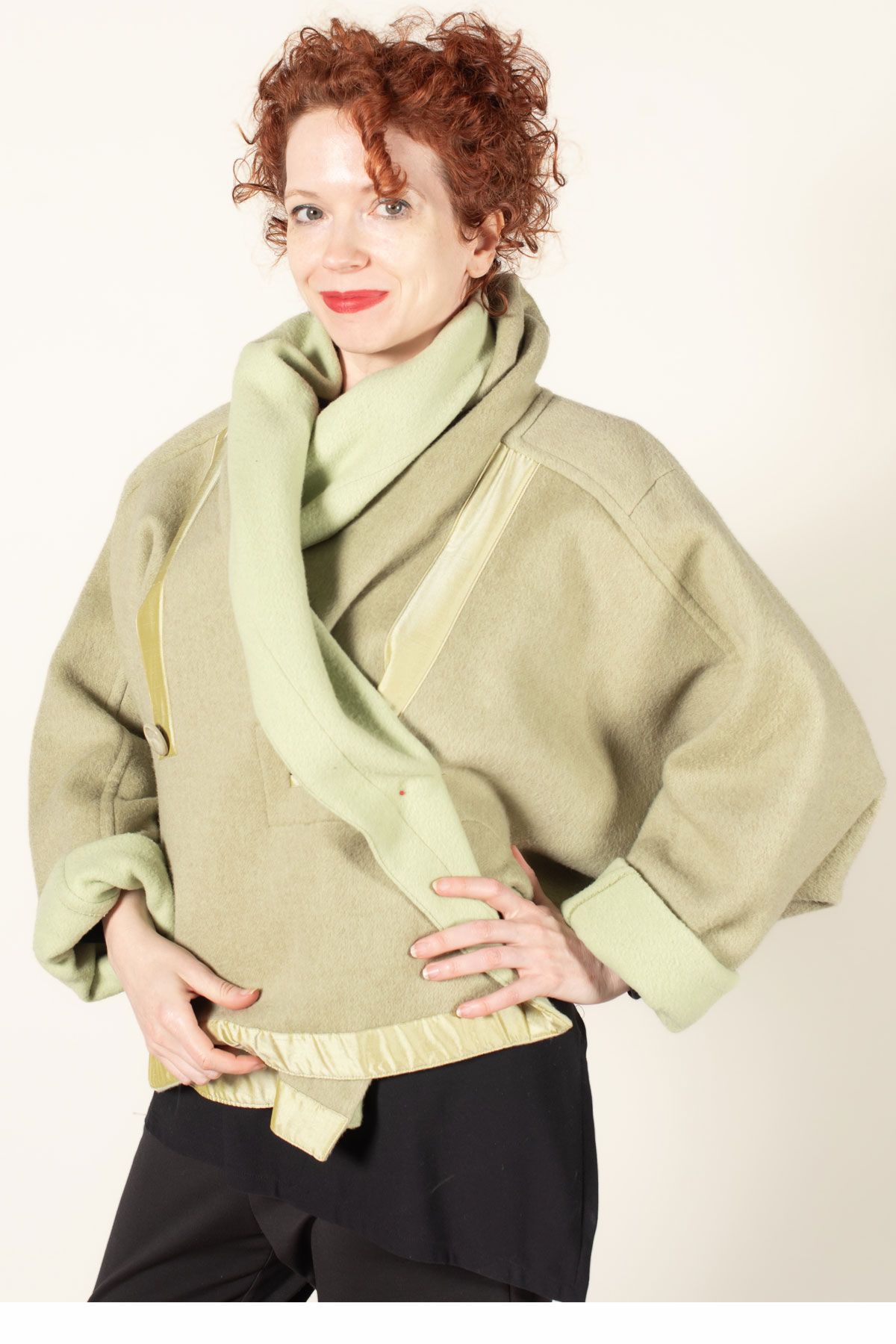 Front view of the Equinox made in a pear green double sided wool fabric.