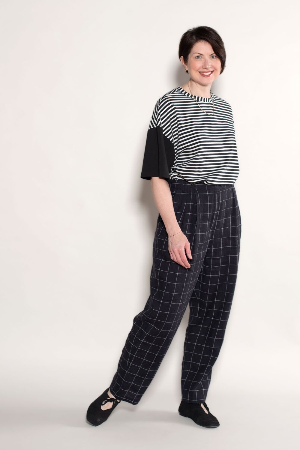 The Hollywood Pants in black linen fabric paired with the Maison Top in black and white striped jersey knit. 