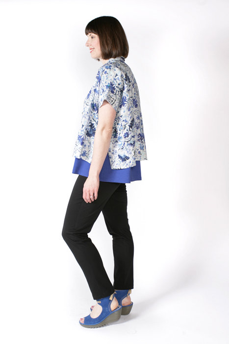 Side view of the Cottage Shirt made in floral linen fabric, worn with the Swing Tee and Pencil Pants. Side view of the Cottage Shirt made in floral linen fabric, worn with the Swing Tee and Pencil Pants.