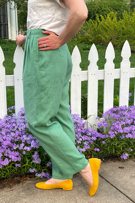 Side view of the Hollywood Pants made in green medium-weight linen fabric. 