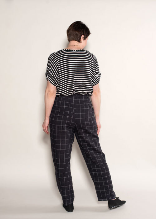 Back view of the Hollywood Pants in black linen fabric paired with the Maison Top in black and white striped jersey knit. 