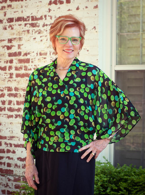 The Coco Blouse made in a green dot sheer silk fabric. 