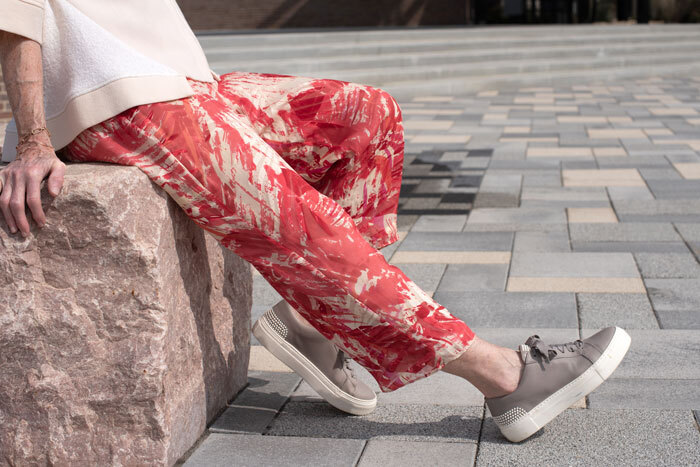 The Chesney Pants made in red print silk fabric. Worn with the West End top. The Chesney Pants made in red print silk fabric. Worn with the West End top.