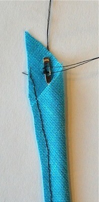 Inserting bodkin into bias tube.